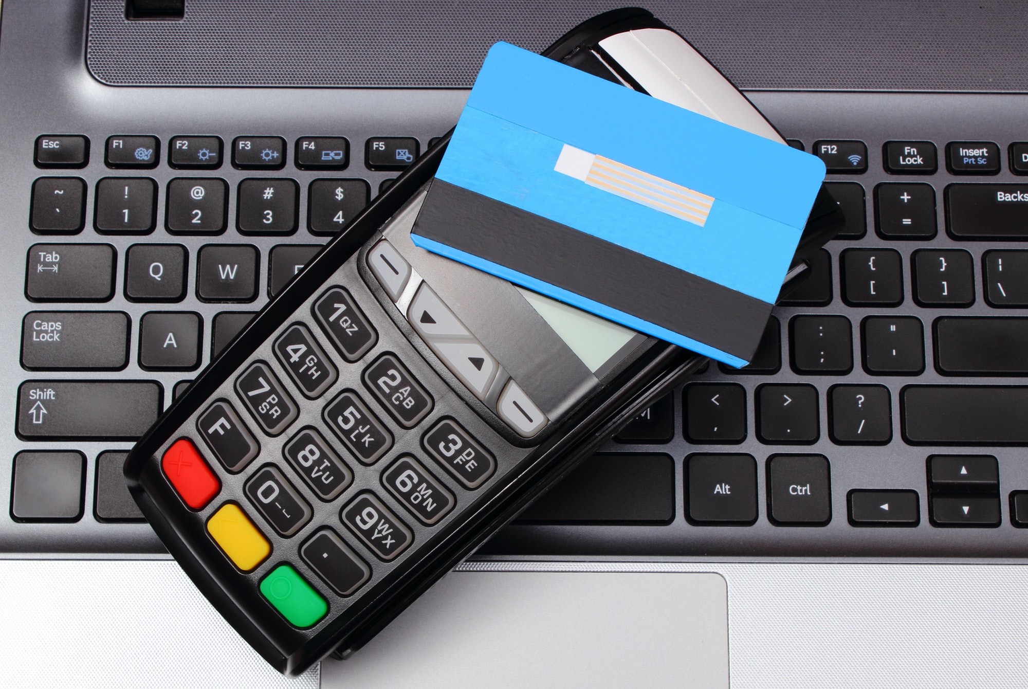 Payment terminal with contactless credit card and laptop